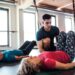Doing pilates in a studio with an instructor